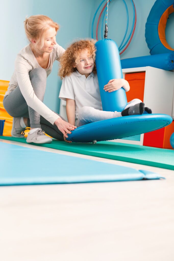 Boy using disc swing